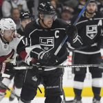 Arizona Coyotes defenseman Kevin Connauton, left, and Los Angeles Kings center Anze Kopitar, of Slovenia, vie for the puck during the second period of a preseason NHL hockey game, Thursday, Sept. 28, 2017, in Los Angeles. (AP Photo/Mark J. Terrill)