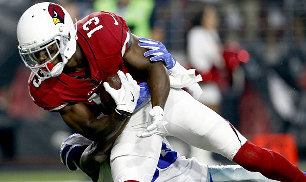 Arizona Cardinals wide receiver Jaron Brown (13) scores a touchdown as Dallas Cowboys cornerback An...