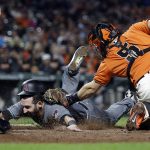 San Francisco Giants catcher Nick Hundley, right, tags out Arizona Diamondbacks' Daniel Descalso in the second inning of a baseball game Friday, Sept. 15, 2017, in San Francisco. Descalso attempted to score on a fielder's choice by Arizona's A.J. Pollock. (AP Photo/Ben Margot)