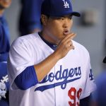Los Angeles Dodgers starting pitcher Hyun-Jin Ryu, of South Korea, gestures in the dugout prior to the team's baseball game against the Arizona Diamondbacks, Tuesday, Sept. 5, 2017, in Los Angeles. (AP Photo/Mark J. Terrill)