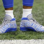 Detroit Lions wide receiver Golden Tate wears cleats adorned with a remembrance of the 9/11 terrorist attacks on the World Trade Center in New York during an NFL football game against the Arizona Cardinals in Detroit, Sunday, Sept. 10, 2017. (AP Photo/Paul Sancya)