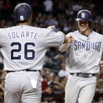 San Diego Padres' Wil Myers celebrates with Yangervis Solarte (26) after hitting a two run home run against the Arizona Diamondbacks during the seventh inning of a baseball game, Saturday, Sept. 9, 2017, in Phoenix. (AP Photo/Matt York)