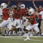 Arizona wide receiver Shun Brown, right, returns a punt for a touchdown against Northern Arizona during the first half of an NCAA college football game, Saturday, Sept. 2, 2017, in Tucson, Ariz. (AP Photo/Rick Scuteri)