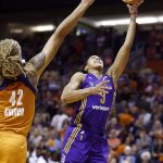 Los Angeles Sparks' Candace Parker, right hits a winning shot as she gets past Phoenix Mercury's Brittney Griner (42) during the second half of Game 3 of a WNBA basketball playoff semifinal Sunday, Sept. 17, 2017, in Phoenix. (AP Photo/Ross D. Franklin)