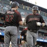 Arizona Diamondbacks' Paul Goldschmidt, right, celebrates with Brandon Drury (27) after hitting a two-run home run off San Francisco Giants pitcher Madison Bumgarner during the first inning of a baseball game Saturday, Sept. 16, 2017, in San Francisco. (AP Photo/Ben Margot)
