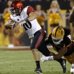 San Diego State quarterback Christian Chapman (10) gets sacked by Arizona State's Alani Latu, right, during the first half of an NCAA college football game Saturday, Sept. 9, 2017, in Tempe, Ariz. (AP Photo/Ross D. Franklin)