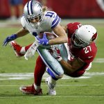 Dallas Cowboys wide receiver Cole Beasley (11) is hit by Arizona Cardinals cornerback Patrick Peterson (21) during the second half of an NFL football game, Monday, Sept. 25, 2017, in Glendale, Ariz. (AP Photo/Ross D. Franklin)