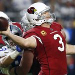 Arizona Cardinals quarterback Carson Palmer (3) throws under pressure from Dallas Cowboys defensive end Tyrone Crawford during the second half of an NFL football game, Monday, Sept. 25, 2017, in Glendale, Ariz. (AP Photo/Ross D. Franklin)