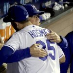 Kansas City Royals' Eric Hosmer gets a hug from manager Ned Yost after coming out of a baseball game during the fifth inning against the Arizona Diamondbacks, Saturday, Sept. 30, 2017, in Kansas City, Mo. (AP Photo/Charlie Riedel)