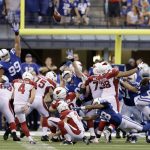 Arizona Cardinals' Phil Dawson (4) kicks a game winning 30-yard field goal out of the hold of Andy Lee (2) in overtime of an NFL football game against the Indianapolis Colts, Sunday, Sept. 17, 2017, in Indianapolis. (AP Photo/Darron Cummings)