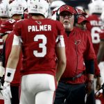 Arizona Cardinals head coach Bruce Arians talks with quarterback Carson Palmer (3) during the second half of an NFL football game against the Dallas Cowboys, Monday, Sept. 25, 2017, in Glendale, Ariz. (AP Photo/Ross D. Franklin)