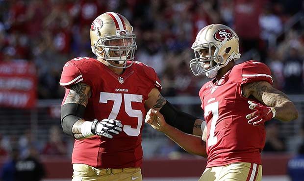 San Francisco 49ers offensive tackle Alex Boone (75) and quarterback Colin Kaepernick (7) react dur...