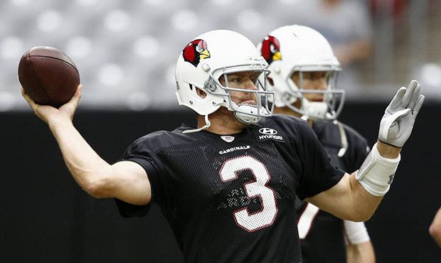 Arizona Cardinals quarterback Carson Palmer throws a pass during NFL football training camp Thursda...