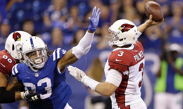 Arizona Cardinals quarterback Carson Palmer (3) throws while being pressured by Indianapolis Colts'...