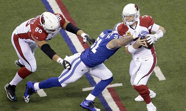 Arizona Cardinals quarterback Carson Palmer (3) is sacked by Indianapolis Colts' John Simon (51) du...