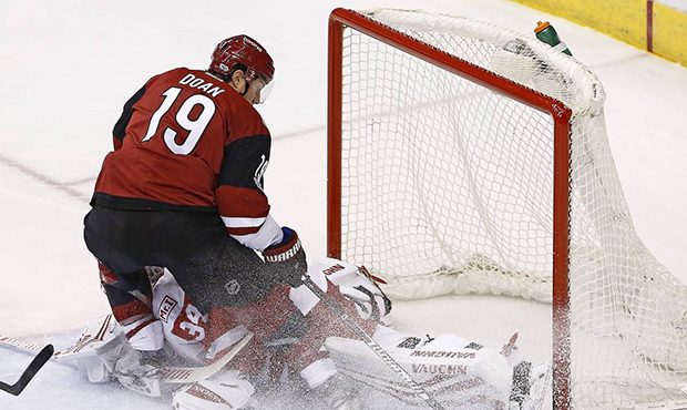Arizona Coyotes right wing Shane Doan collides with Detroit Red Wings goalie Petr Mrazek (34) as Do...