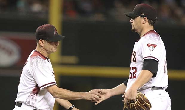 Arizona Diamondbacks manager Torey Lovullo takes the ball from starting pitcher Zack Godley after h...