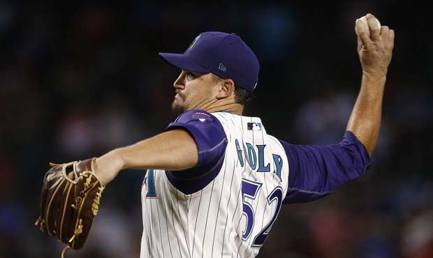 Arizona Diamondbacks' Zack Godley throws a pitch against the Colorado Rockies during the first inni...