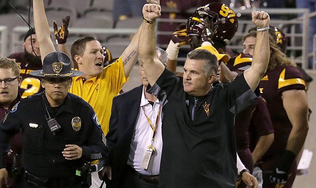 Arizona State coach Todd Graham raises his arms after Arizona State defeated Oregon 37-35 during an...