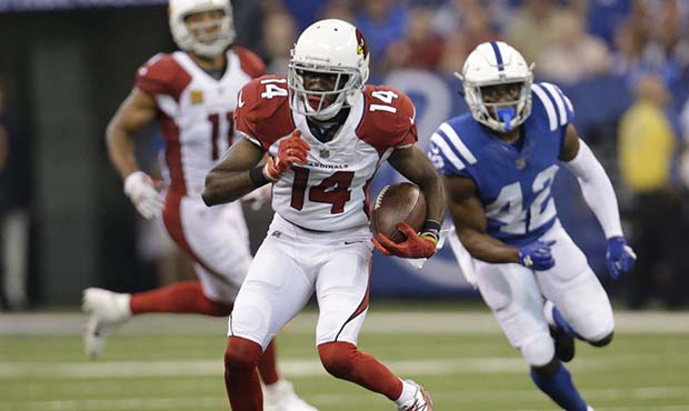 Arizona Cardinals' J.J. Nelson (14) is chased by Indianapolis Colts' Kenny Moore during the first h...