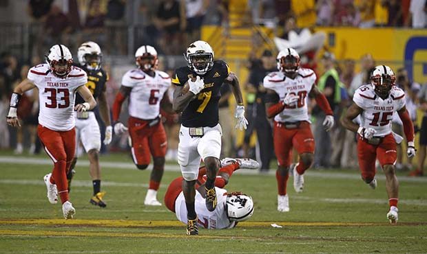 Arizona State's Kalen Ballage (7) runs past Texas Tech defenders for a touchdown during the second ...