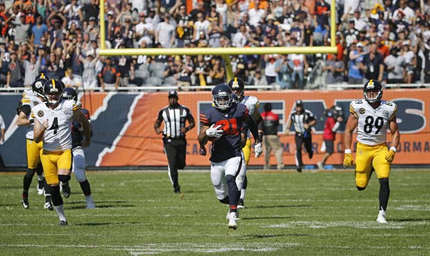 Chicago Bears cornerback Marcus Cooper (31) runs with the recovered ball after Bears cornerback She...