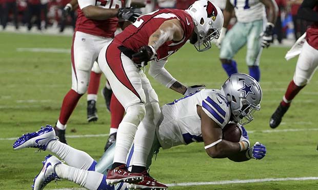Dallas Cowboys running back Ezekiel Elliott (21) scores a touchdown as Arizona Cardinals free safet...