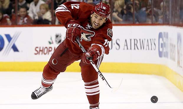 Phoenix Coyotes' Paul Bissonnette passes the puck against the Colorado Avalanche during the second ...