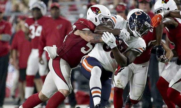 Chicago Bears tight end Dion Sims (88) is hit by Arizona Cardinals inside linebacker Scooby Wright,...