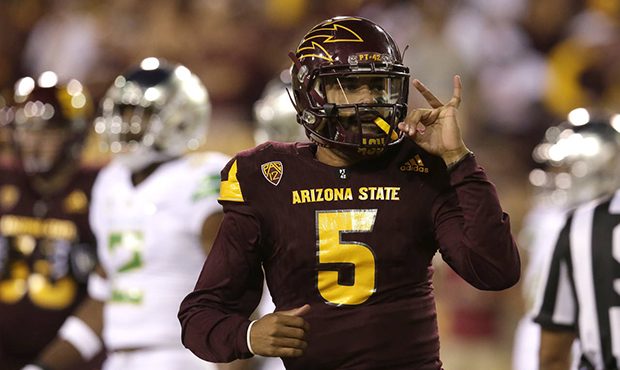 Arizona State quarterback Manny Wilkins (5) motions to fans in the student section after scoring a ...