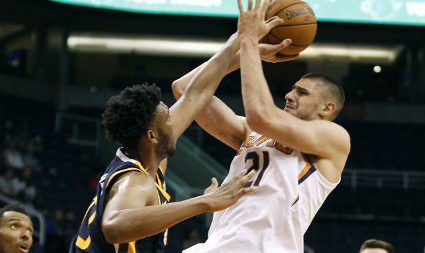 Phoenix Suns center Alex Len (21) attempts a shot over the defense of Utah Jazz center Tony Bradley...