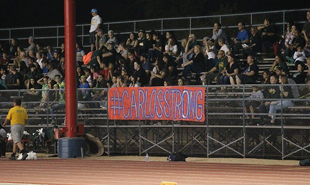 Moon Valley fans remember Carlos Sanchez at the team's final home game Friday. (Photo by Jami Nish/...