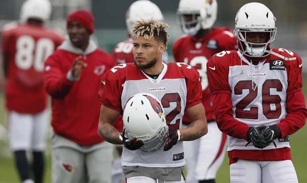 Safety Tyrann Mathieu of the Arizona Cardinals, left, and Brandon Williams, right, attend an NFL tr...