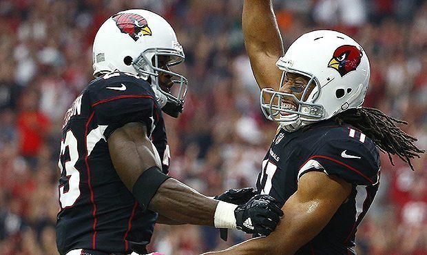 Arizona Cardinals wide receiver Larry Fitzgerald (11) celebrates his touchdown catch against the Ta...