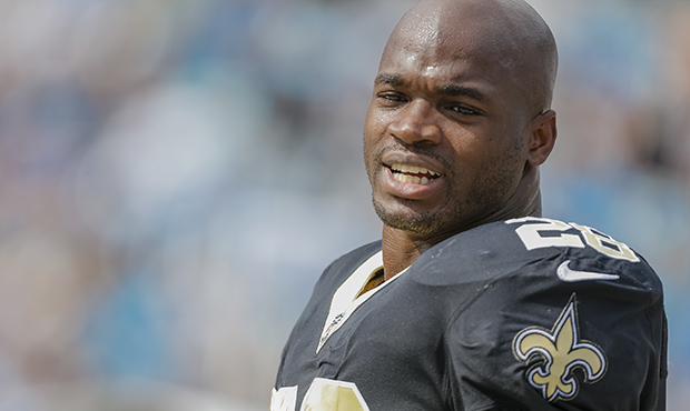 New Orleans Saints' Adrian Peterson (28) on the sidelines during the second half of an NFL football...