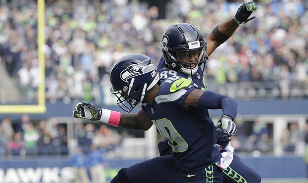 Seattle Seahawks wide receivers Paul Richardson, left, and wide receiver Doug Baldwin, right, celeb...
