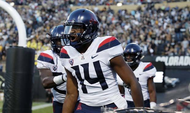 Arizona quarterback Khalil Tate celebrates after running for a touchdown against Colorado in the fi...