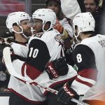 Arizona Coyotes left wing Anthony Duclair, center, celebrates with defenseman Alex Goligoski, left, and right wing Tobias Rieder after scoring a goal during the first period of an NHL hockey game against the Anaheim Ducks in Anaheim, Calif., Thursday, Oct. 5, 2017. (AP Photo/Kelvin Kuo)