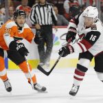 Arizona Coyotes' Max Domi, right, shoots the puck past Philadelphia Flyers' Taylor Leier, left, during the first period of an NHL hockey game, Monday, Oct. 30, 2017, in Philadelphia. (AP Photo/Chris Szagola)