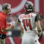 Tampa Bay Buccaneers head coach Dirk Koetter, left, talks with quarterback Ryan Fitzpatrick (14) during the first half of an NFL football game against the Arizona Cardinals, Sunday, Oct. 15, 2017, in Glendale, Ariz. (AP Photo/Rick Scuteri)