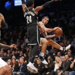 Phoenix Suns guard Mike James, right, looks to pass to Suns center Tyson Chandler, far left, but has to get around the defense of Brooklyn Nets forward Rondae Hollis-Jefferson (24) in the second half of an NBA basketball game, Tuesday, Oct. 31, 2017, in New York. The Suns defeated the Nets 122-114. (AP Photo/Kathy Willens)