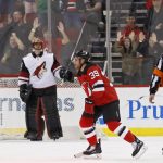 New Jersey Devils' Brian Gibbons (39) skates past Arizona Coyotes goalie Louis Domingue after scoring a penalty shot goal during the first period of an NHL hockey game Saturday, Oct. 28, 2017, in Newark, N.J. (AP Photo/Adam Hunger)