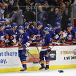 New York Islanders' John Tavares (91) and Jordan Eberle (7) celebrate with teammates after Tavares scored during the third period of an NHL hockey game against the Arizona Coyotes Tuesday, Oct. 24, 2017, in New York. Tavares scored three goals as the Islanders won 5-3. (AP Photo/Frank Franklin II)