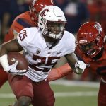 Washington State running back Jamal Morrow (25) runs a way from the tackle of Arizona safety Demetrius Flannigan-Fowles in the first half during an NCAA college football game, Saturday, Oct. 28, 2017, in Tucson, Ariz. (AP Photo/Rick Scuteri)