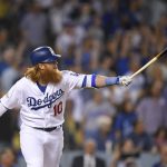 Los Angeles Dodgers' Justin Turner watches his three-run home run against the Arizona Diamondbacks during the first inning of Game 1 of a baseball National League Division Series in Los Angeles, Friday, Oct. 6, 2017. (AP Photo/Mark J. Terrill)