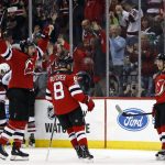 New Jersey Devils' Jesper Bratt (63) celebrates scoring a goal with teammates against the Arizona Coyotes during the third period of an NHL hockey game, Saturday, Oct. 28, 2017, in Newark, N.J. The Devils won 4-3. (AP Photo/Adam Hunger)