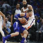 Los Angeles Clippers' Blake Griffin, front, is defended by Phoenix Suns' Tyson Chandler during the first half of an NBA basketball game Saturday, Oct. 21, 2017, in Los Angeles. (AP Photo/Jae C. Hong)