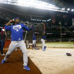 Los Angeles Dodgers right fielder Yasiel Puig warms up prior to game 3 of baseball's National League Division Series against the Arizona Diamondbacks, Monday, Oct. 9, 2017, in Phoenix. (AP Photo/Ross D. Franklin)