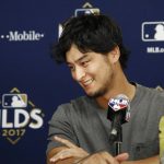 Los Angeles Dodgers starting pitcher Yu Darvish (21), of Japan, smiles after answering a question during a news conference before Game 3 of baseball's National League Division Series against the Arizona Diamondbacks Sunday, Oct. 8, 2017, in Phoenix. (AP Photo/Ross D. Franklin)