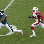 Philadelphia Eagles' Nelson Agholor, left, catches a touchdown pass against Arizona Cardinals' Budda Baker during the second half of an NFL football game, Sunday, Oct. 8, 2017, in Philadelphia. (AP Photo/Michael Perez)